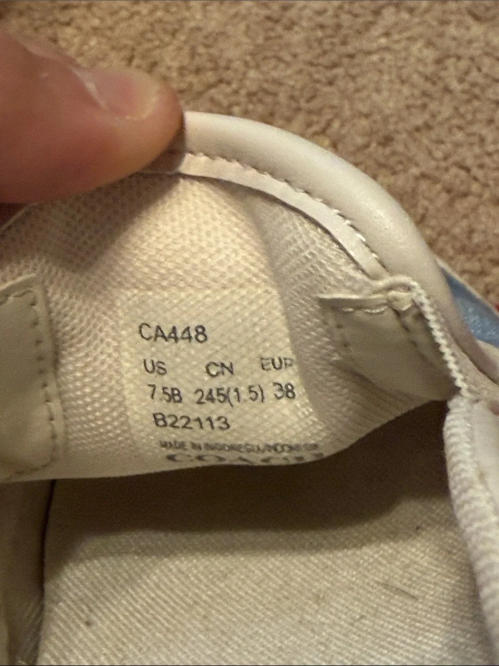 Coach Light Blue Signature Slip-On Sneakers with White Trim.